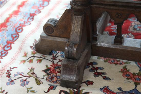 A Victorian gothic revival oak centre table, designed by Collier & Plucknett, Warwick, W.5ft D.5ft H.2ft 7in.